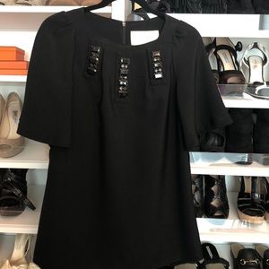 Black crepe boxy long top with stone detail.